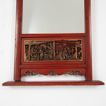 A lacquered mirror, Qing dynasty, 19th century.