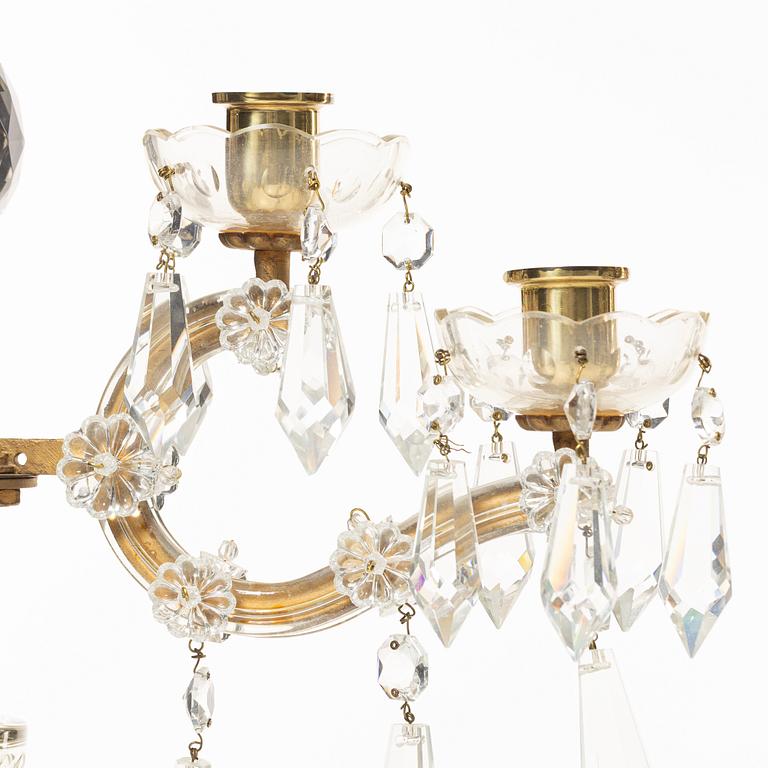 A pair of brass and glass canelabras, first half of the 20th century.