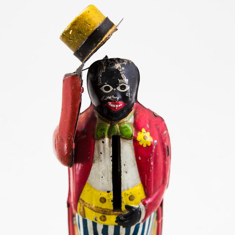 A tinplate coin bank by J. Levy & Co, England, probably of German manufacture, ca 1909.