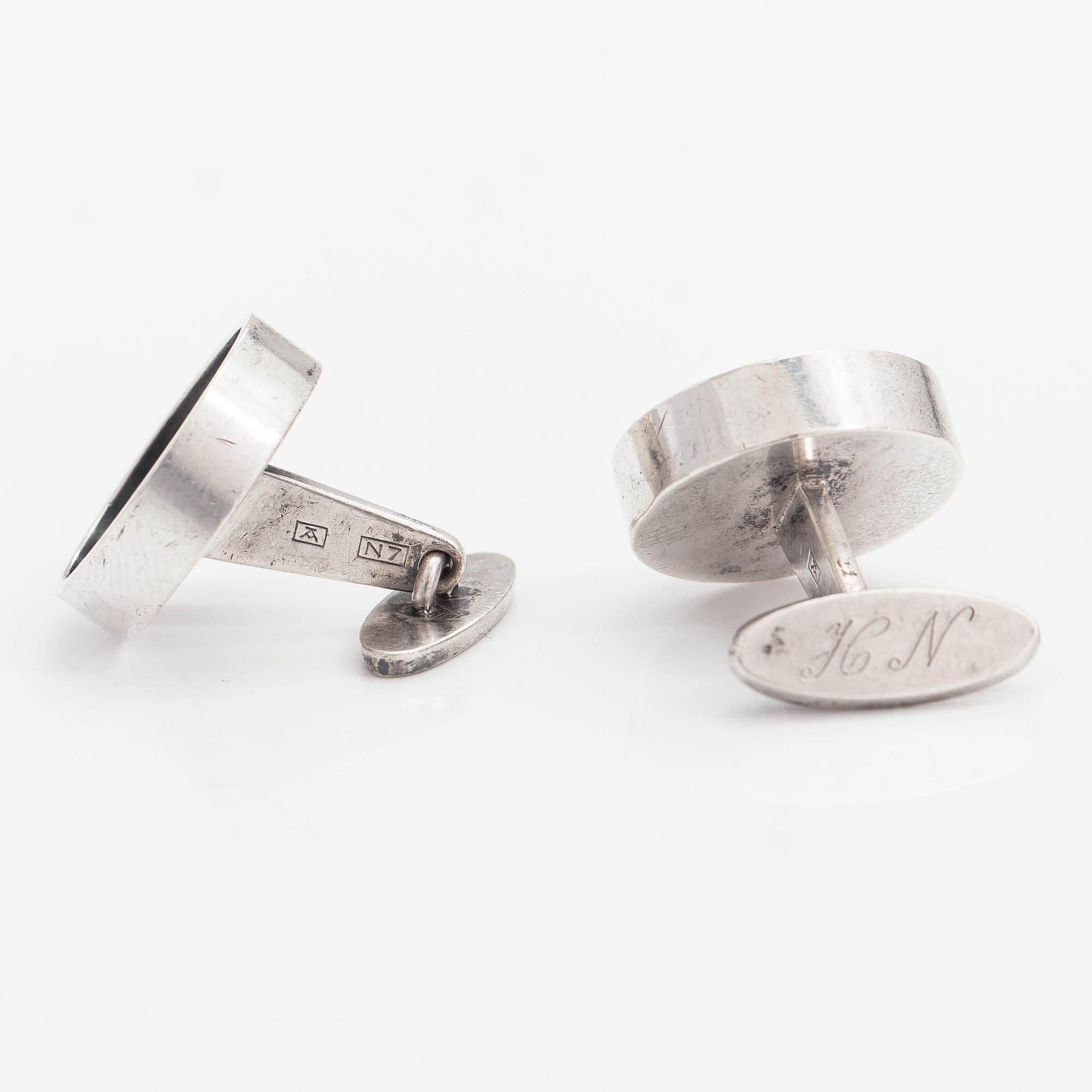 Elis Kauppi, A pair of silver cufflinks with tiger's eye. Kupittaan kulta, Turku 1966.