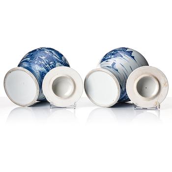 A pair of blue and white Chinese porcelain jars with covers. Qing dynasty, Qianlong (1736-95).