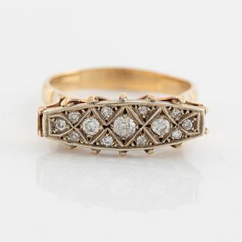An 18K gold ring set with round brilliant- and eight-cut diamonds.