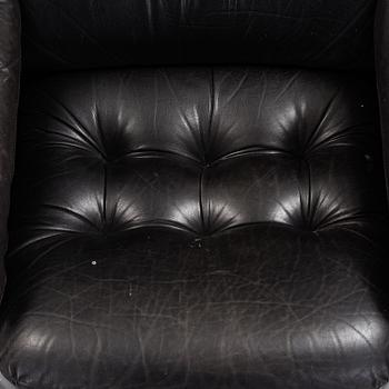 A pair of leather upholstered easy chairs from Dux, late 20th Century.