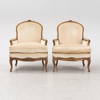 A pair of Louis XV-style lounge chairs, 20th Century.