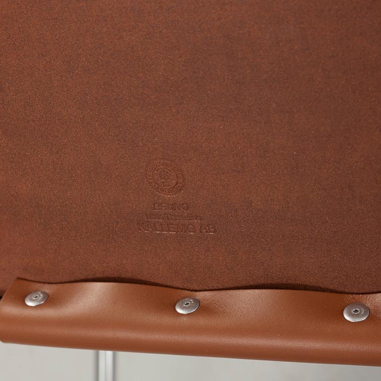 Mats Theselius, A pair of 'Bruno' brown leather and steel easy chairs, Källemo, Sweden.