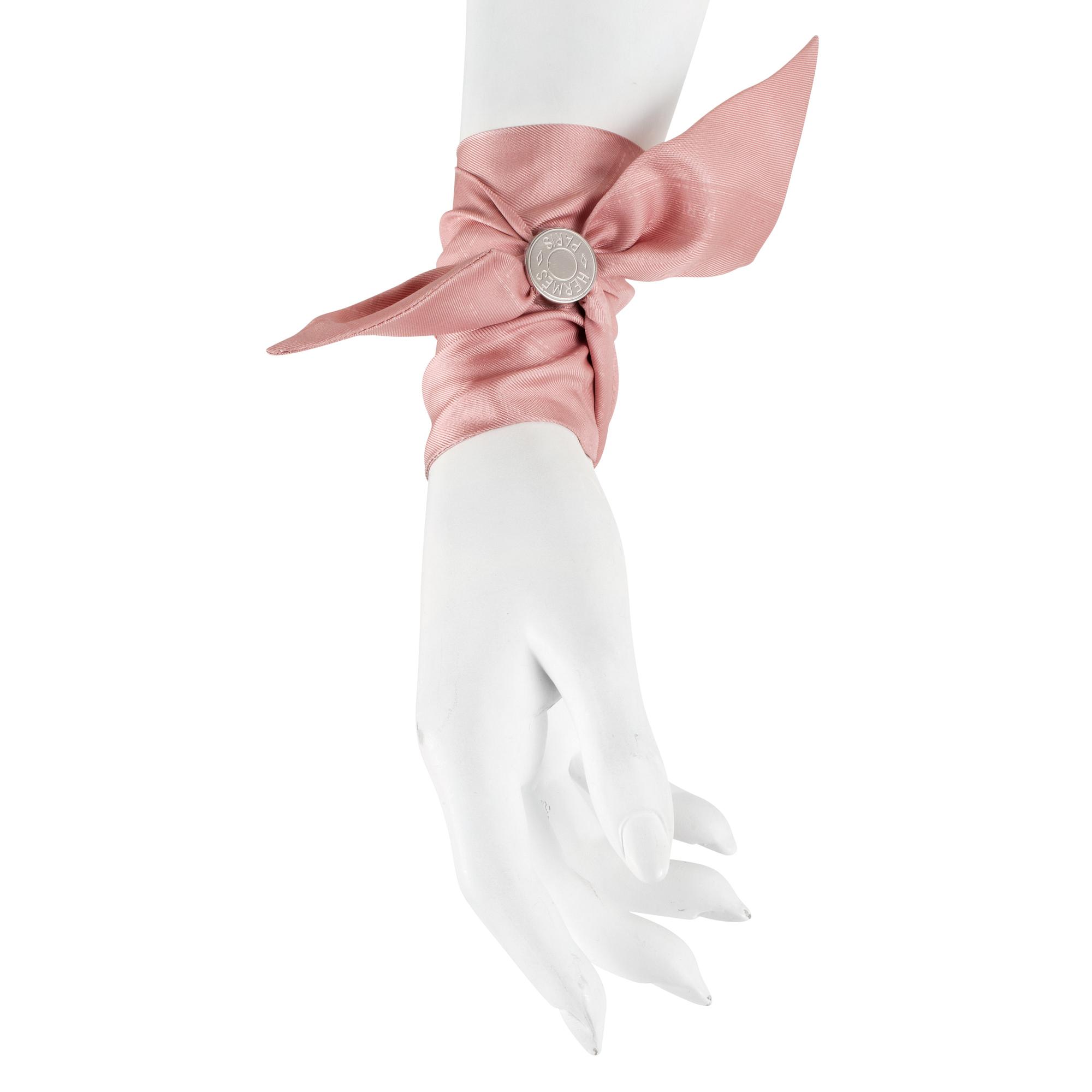 HERMÈS, three silk braclets with palladiumcovered locks.