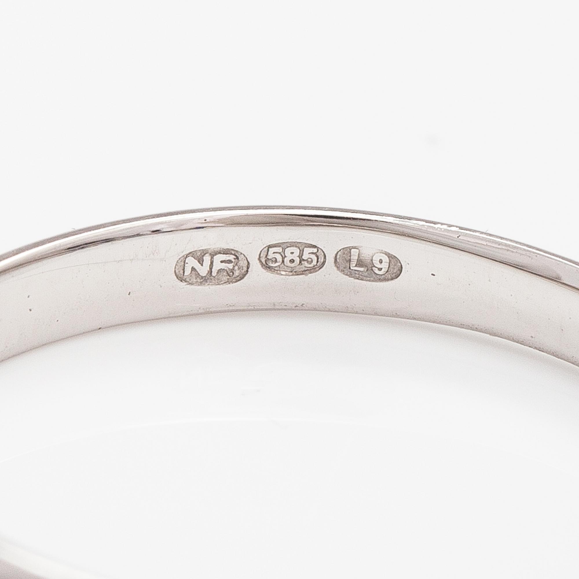 A 14K white gold ring with sapphires.