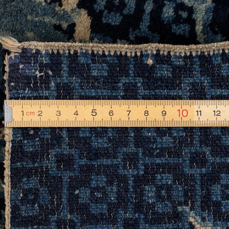 A Chinese 'dragon' rug, circa 1920. (c 190x122 cm).