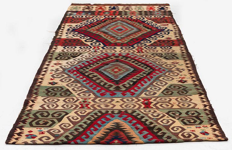 An antique Central Anatolian kilim, c. 273 x 101 cm.