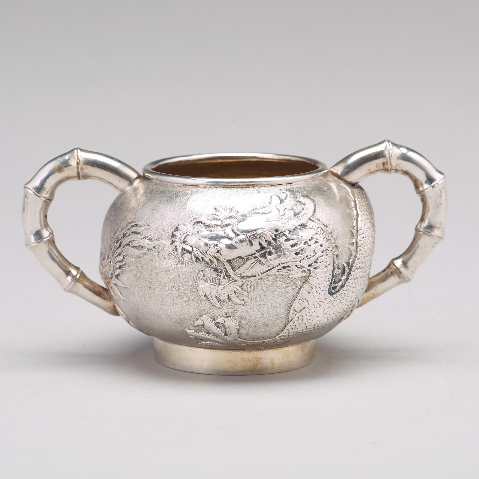 A Chinese four piece silver tea set, Luen Wo, Shanghai, 1875-1925.