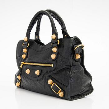 Balenciaga, a black leather 'City' handbag.