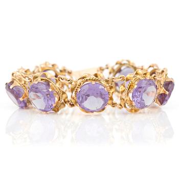 ARMBAND med fasetterade syntetiska färgförändring safirer.