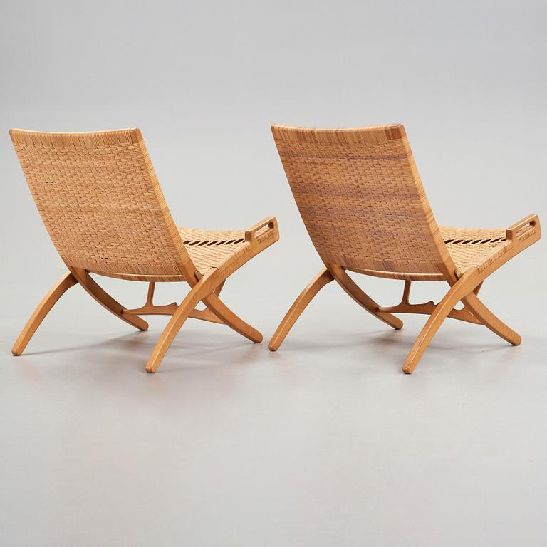 Hans J. Wegner, a pair of model 512 oak 'Folding Chairs' executed by Johannes Hansen, Denmark 1950's.