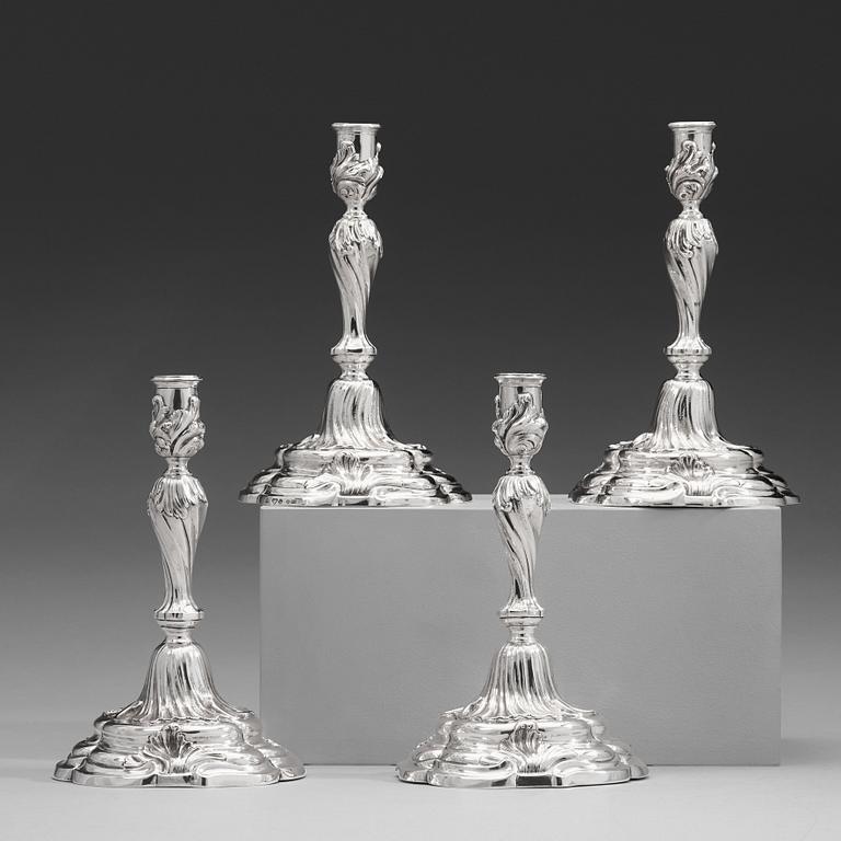 Two pairs of Swedish 19th and 20th century silver candlesticks, mark of Mollenborg and Jensen, Stockholm 1857 and 1936.