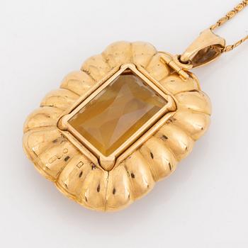 Hänge 18K guld med en fasettslipad citrin.