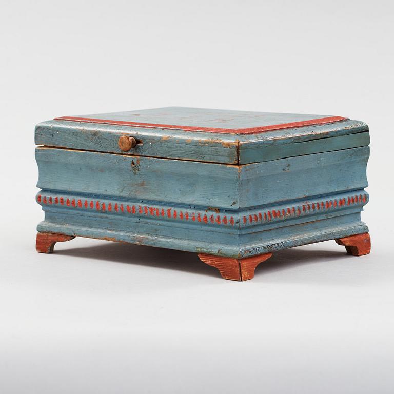 a wooden box marked JJD 1814.