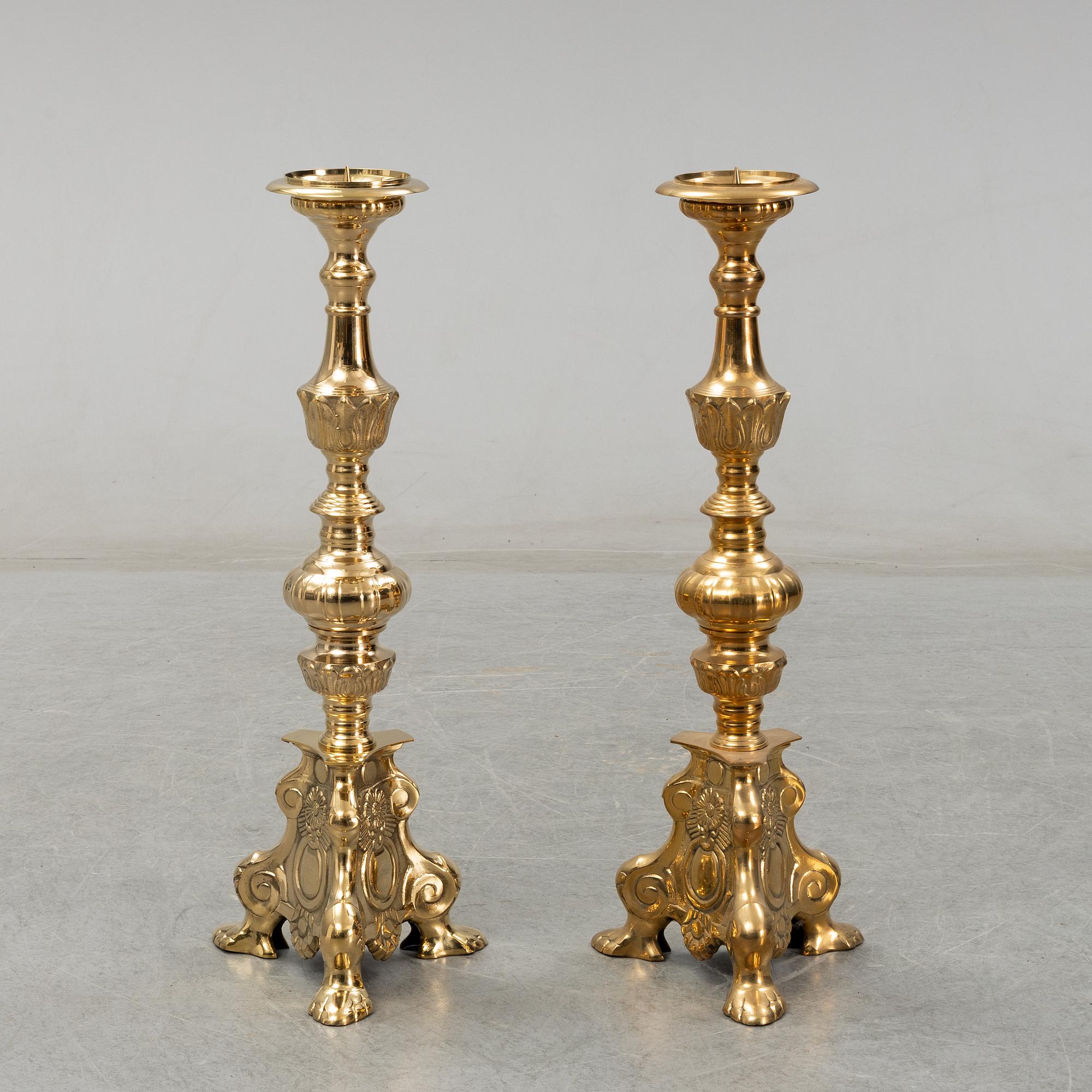 A pair of late 20th century or early 21th century brass altar candlesticks.