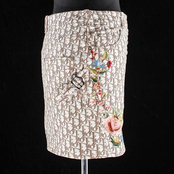 A monogram patterned skirt and plastic slip-in by Christian Dior.