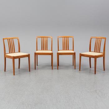A 1950/60s teak and valnut table and four chairs.