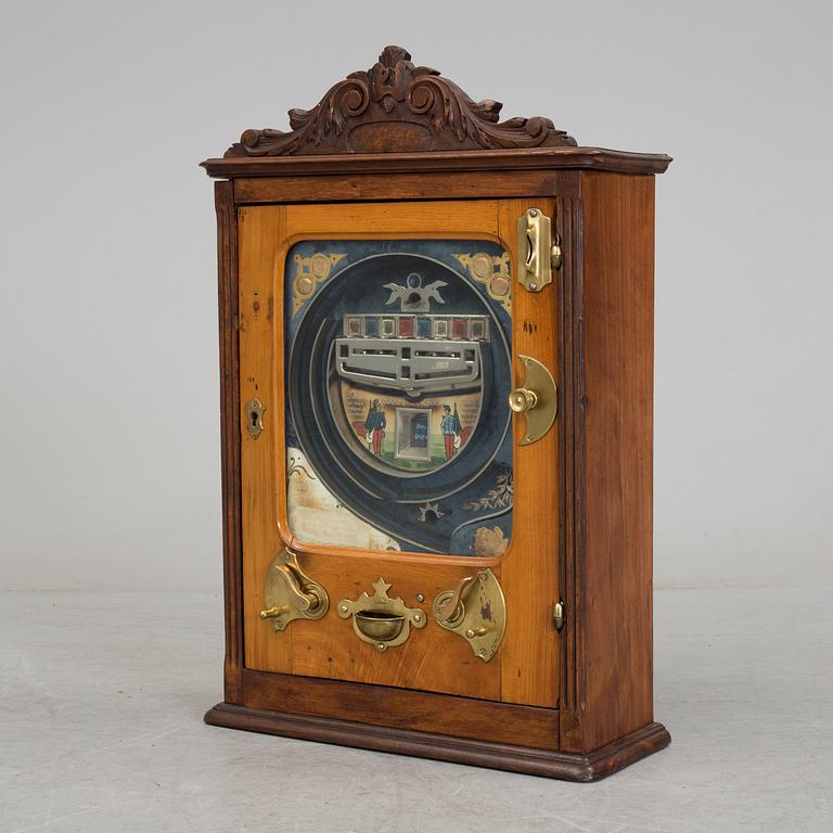 A 'Coleurs Nationales' Bussouz slot machine, Paris, France, circa 1900.