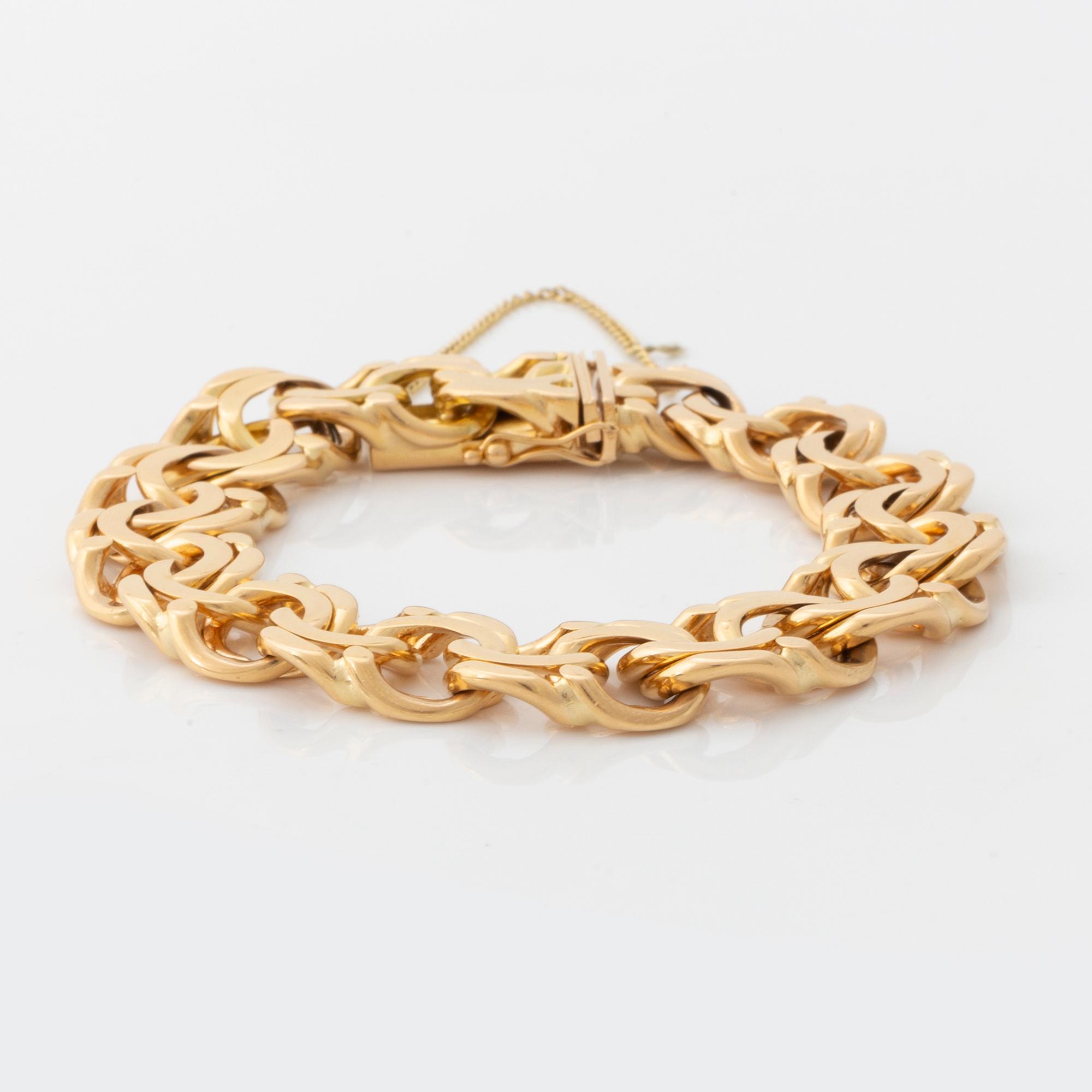 An 18K gold bracelet.
