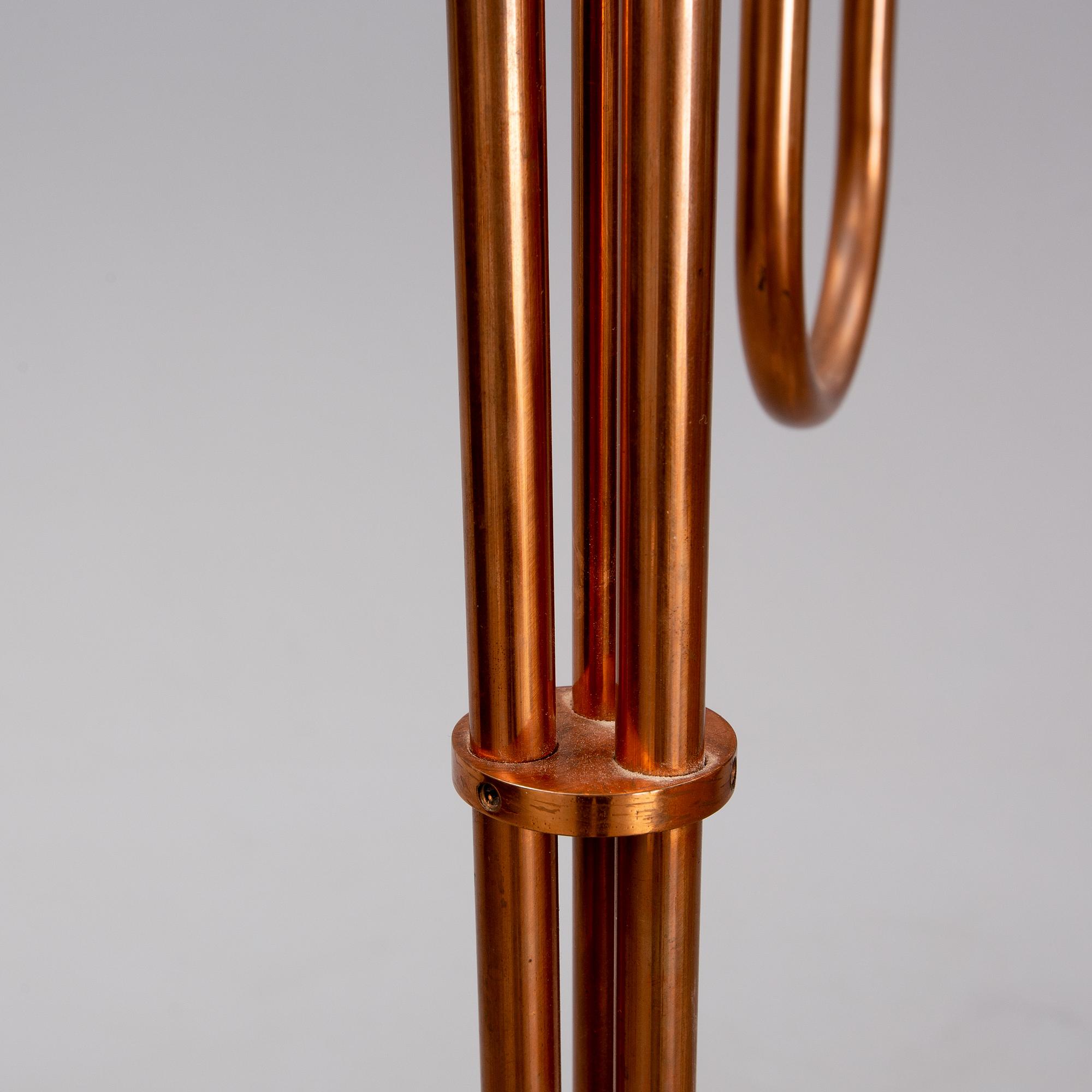 A 20th century Swedish Modern three-armed floor light.