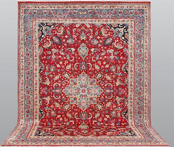 An old Meshed carpet, c. 342 x 252 cm.