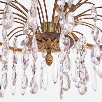 A Gustavian gilt brass and cut glass four-light chandelier, Stockholm, late 18th century.