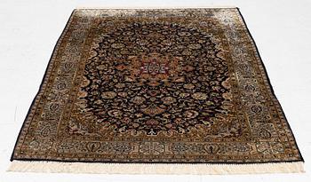 A Ghom, silk rug, c. 162 x 102 cm.