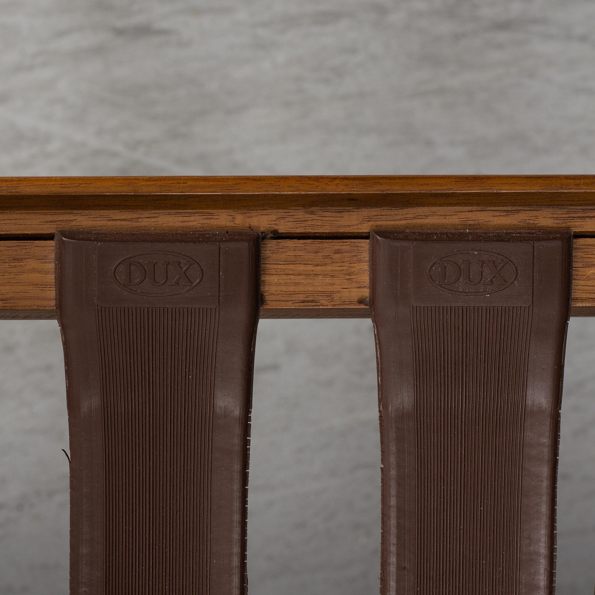 A pair of 'USA 75' teak easy chairs by Folke Ohlsson for Dux.