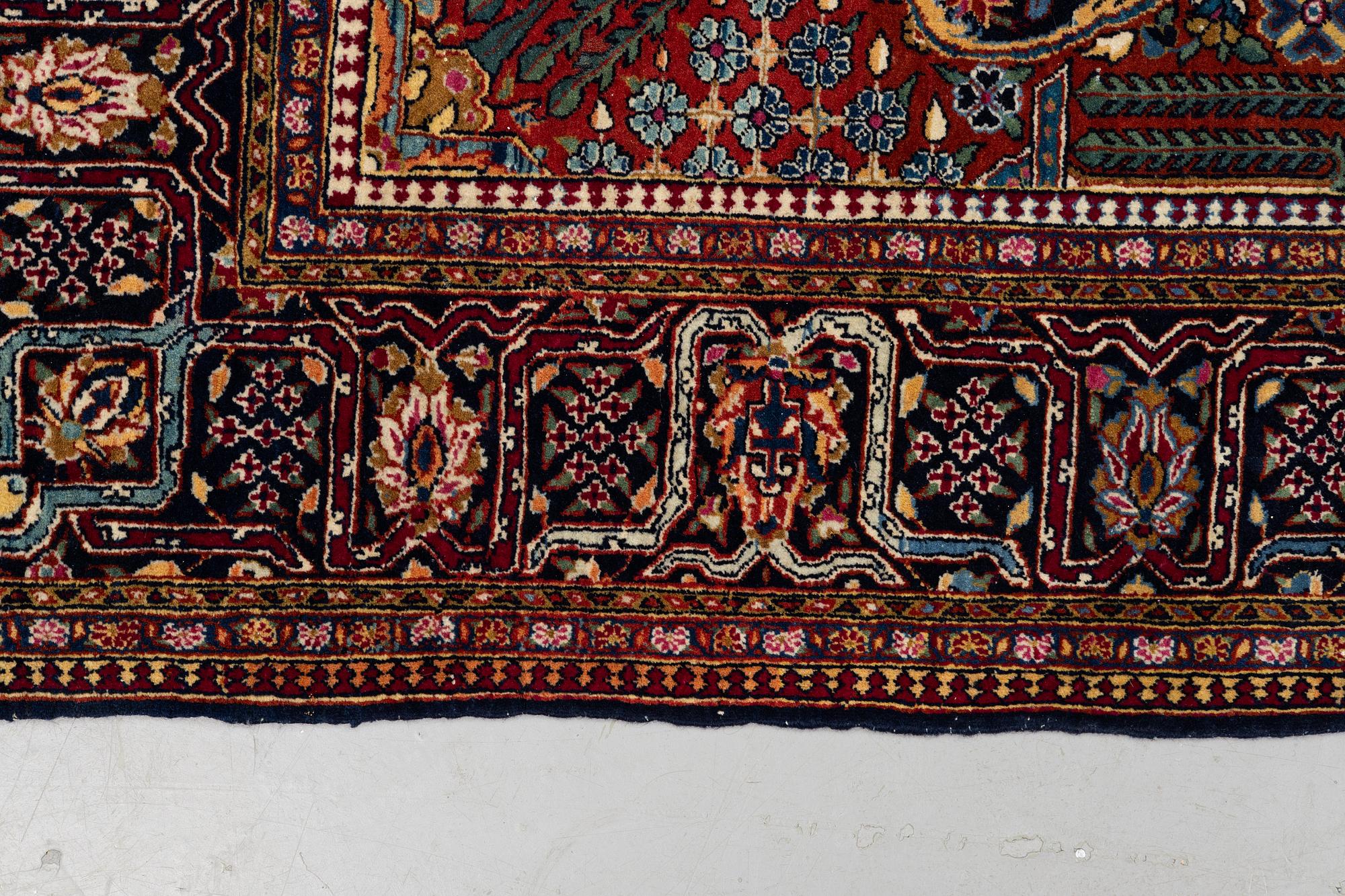 A rug, semi-antique Kashan, ca 216,5 x 140 cm.
