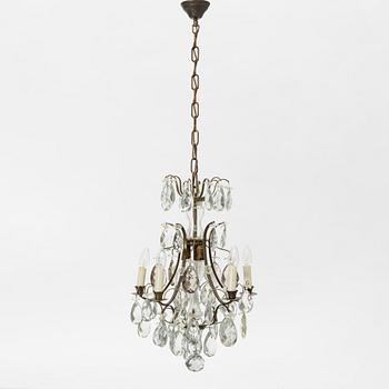 Takkrona, rokokostil, 1900-talets första hälft.