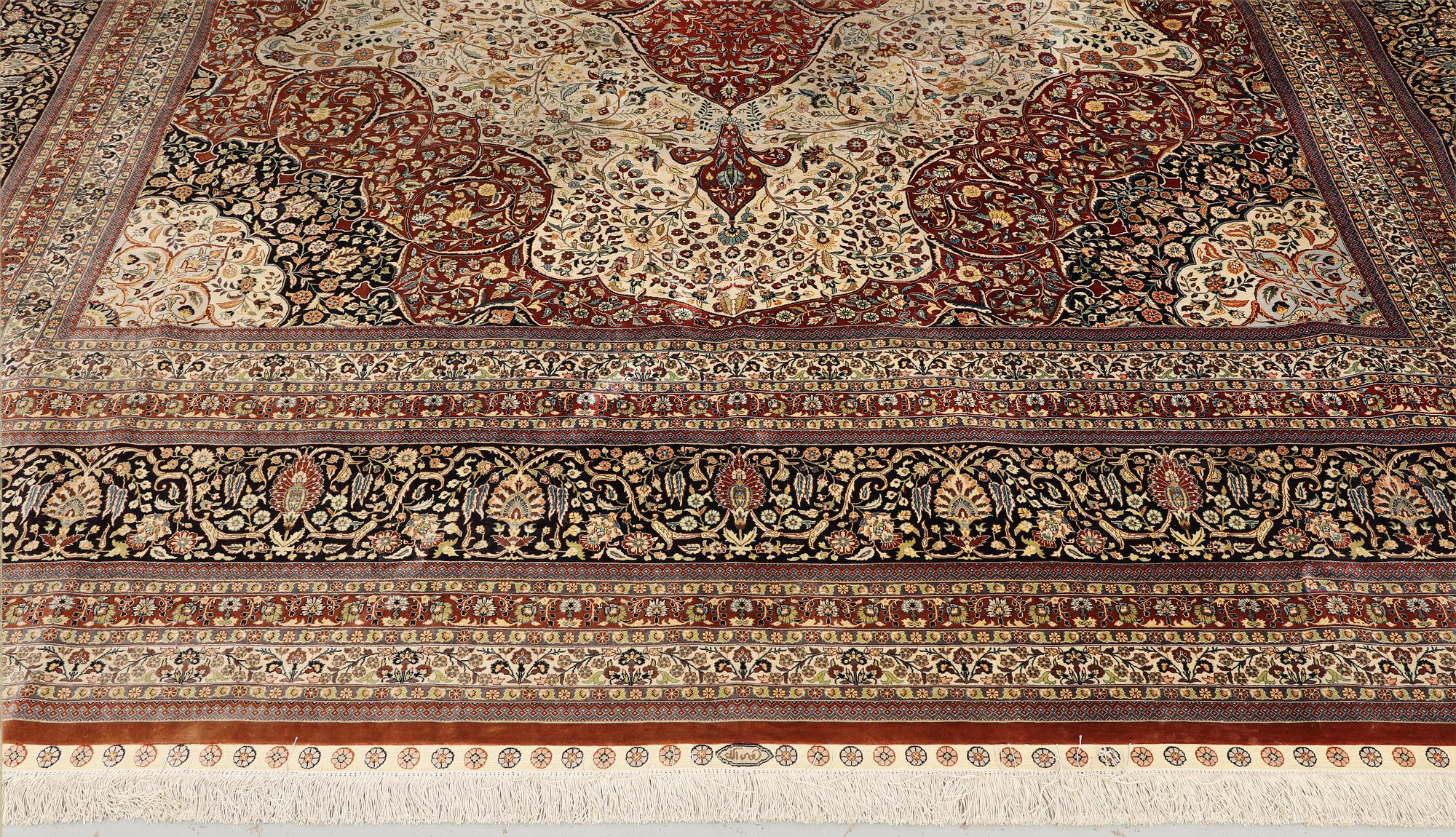 An Oriental silk carpet, c. 436 x 306 cm.