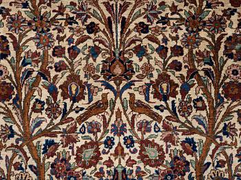 A RUG. A semi-antique silk Kashan. 205,5 x 131,5 cm.