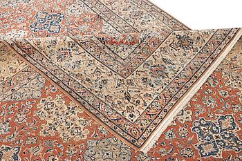 A semi-antique/old Nain carpet, part silk, c. 343 x 230 cm.