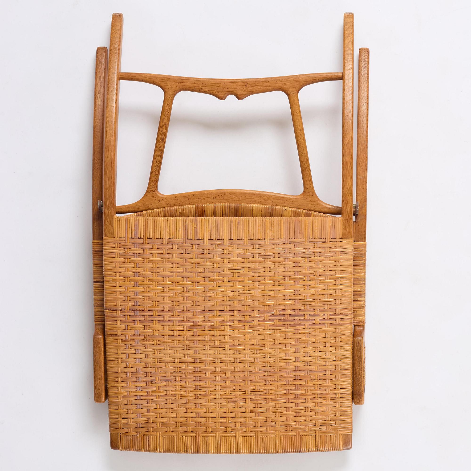 Hans J. Wegner, a foldable easy chair model 512, Johannes Hansen, Copenhagen, 1950s-60s.