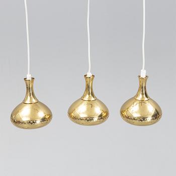 A set of three brass pendule lights, second half of the 20th Century.