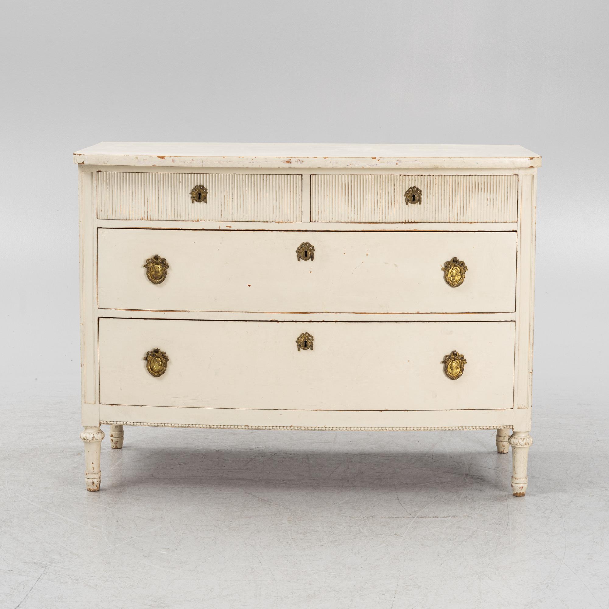 A painted oak chest of drawers from around the year 1900.