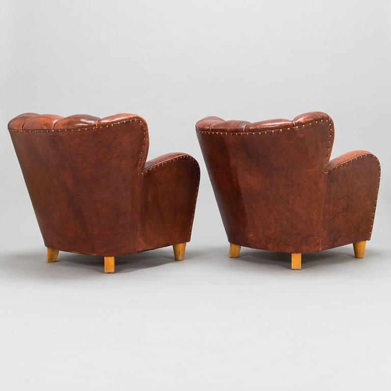 A pair of mid-20th century armchairs.