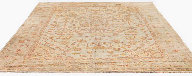 An antique Ushak carpet, c. 335 x 259 cm.