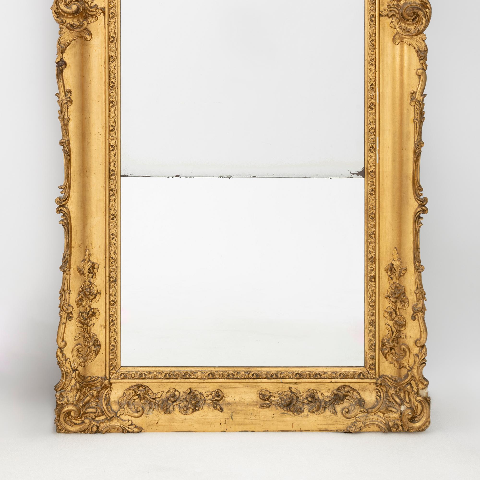 A Rococo style mirror, late 19th Century.