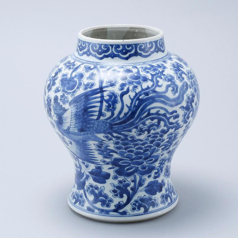 A blue and white Chinese Kangxi vase.