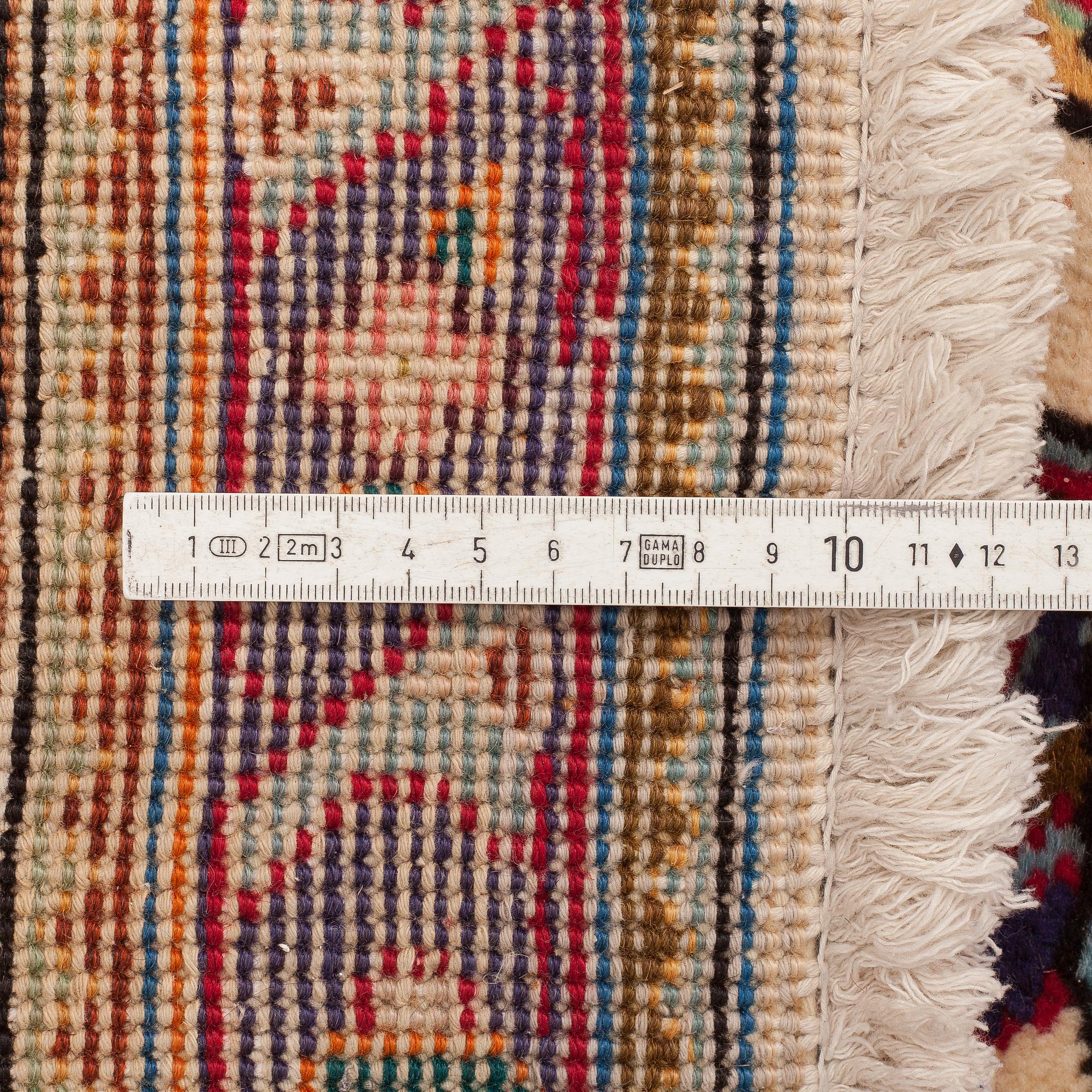 A carpet from Tabriz, around 388 x 294 cm.