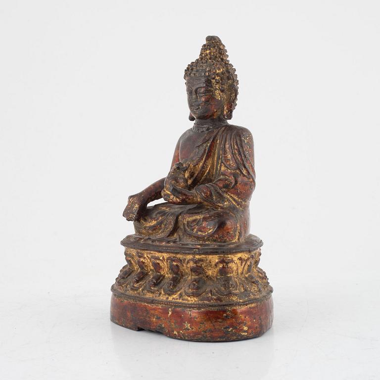 A seated bronze figure of Buddha, probably late Ming dynasty (1368-1644).