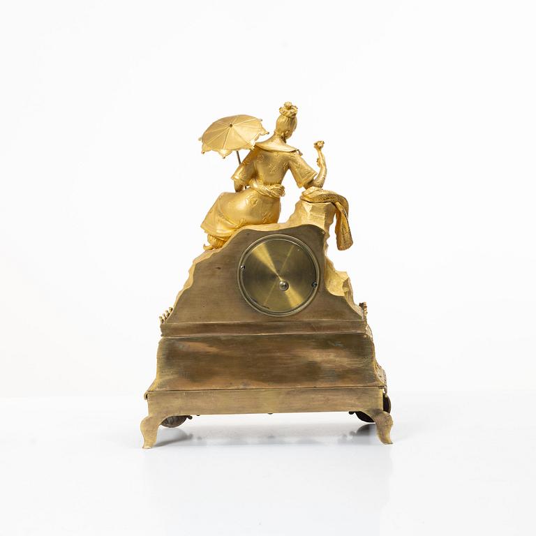 A Late Empire table clock, 19th century.
