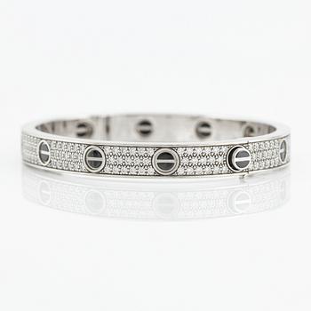 An 18K white gold Cartier bracelet "Love" with round brilliant-cut diamonds and ceramic.