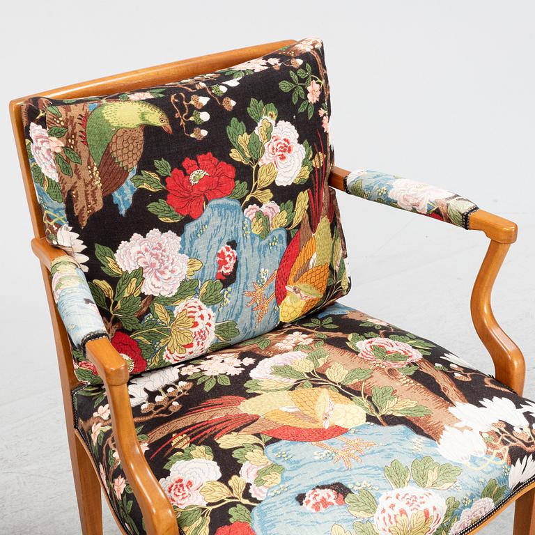 Josef Frank, two mahogany and rattan armchairs, model 969, Firma Svenskt Tenn.