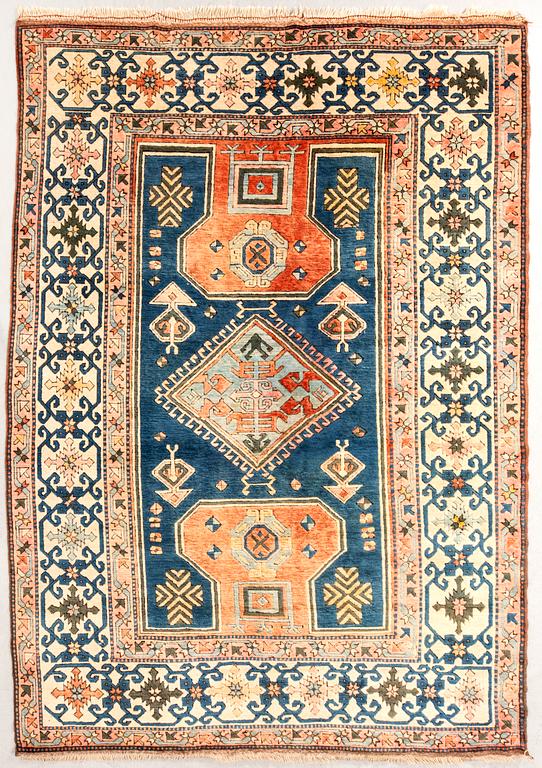 A semaintique Konya carpet ca 330x226 cm.