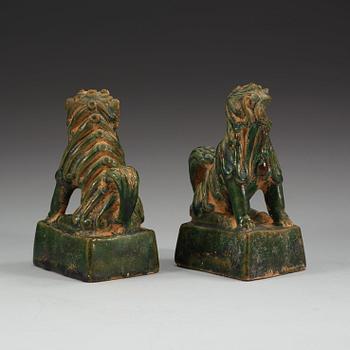 A pair of green glazed joss stick holders, Ming dynasty (1368-1644).