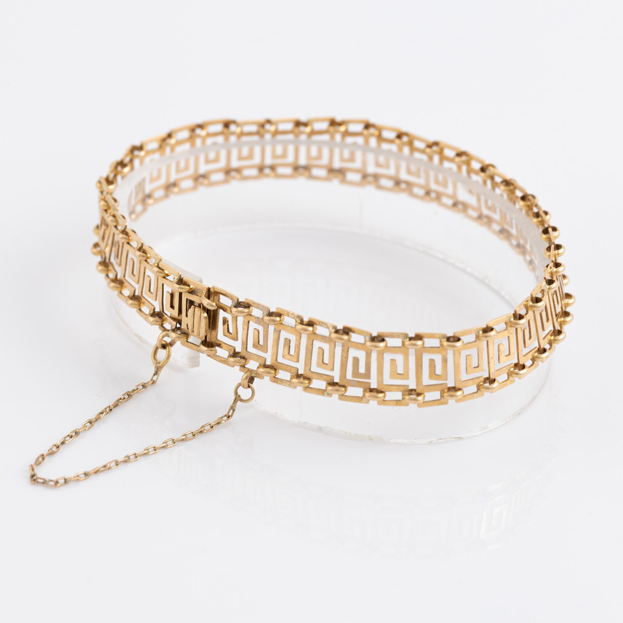 Armband samt ring, guld, dekor av meanderbård.